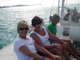 Pat, Sandy and Colleen on the catamaran