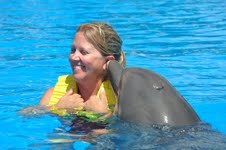 Mom...Lynette enjoys her swim with the kids and dolphins